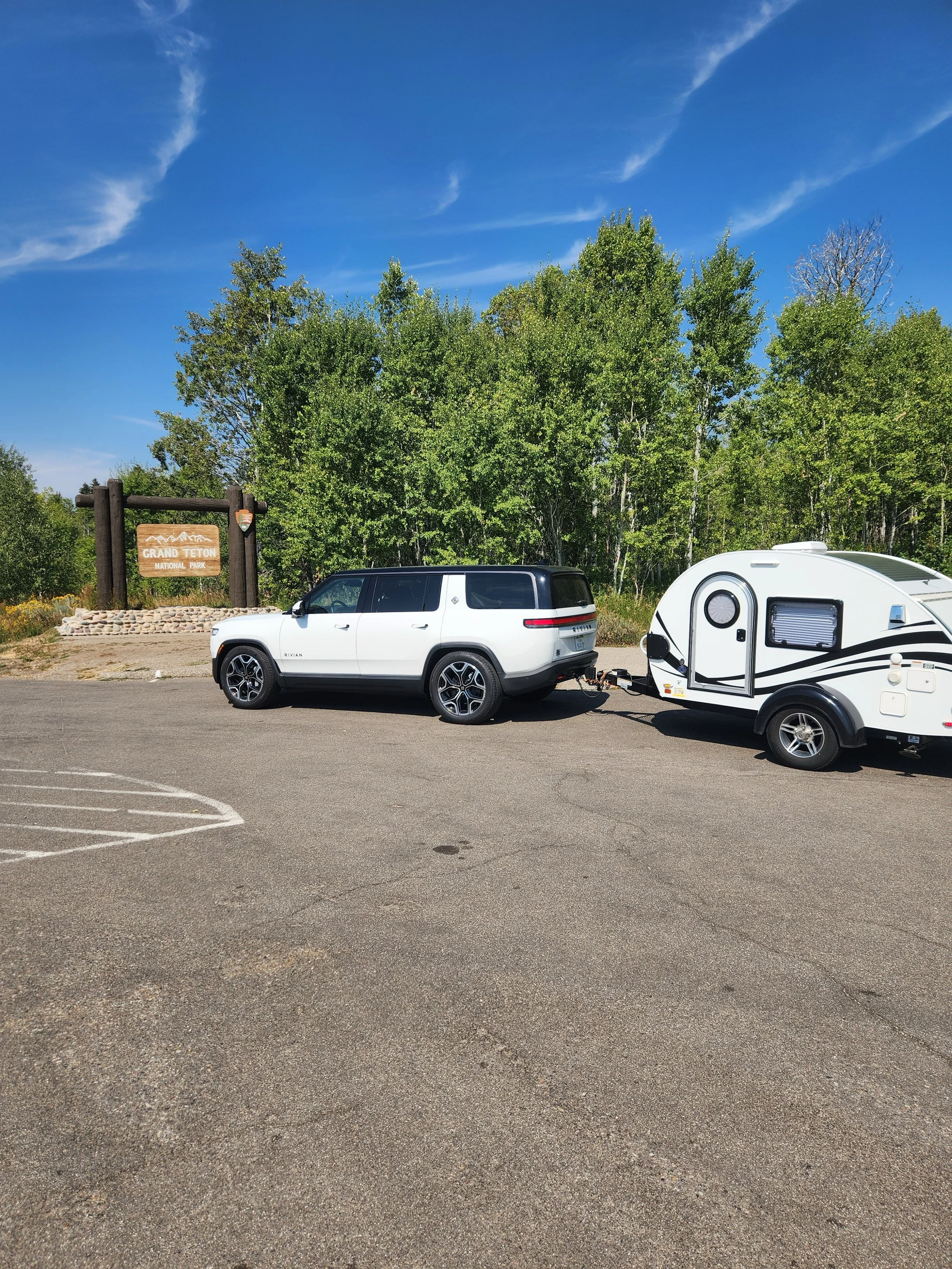 EV towing a teardrop trailer in grand teton