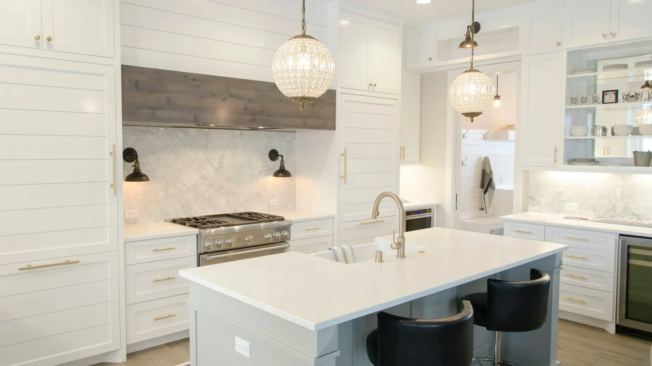 Spotless white kitchen with island, representing CDA Home Cleaning's house cleaning service in Post Falls, ID