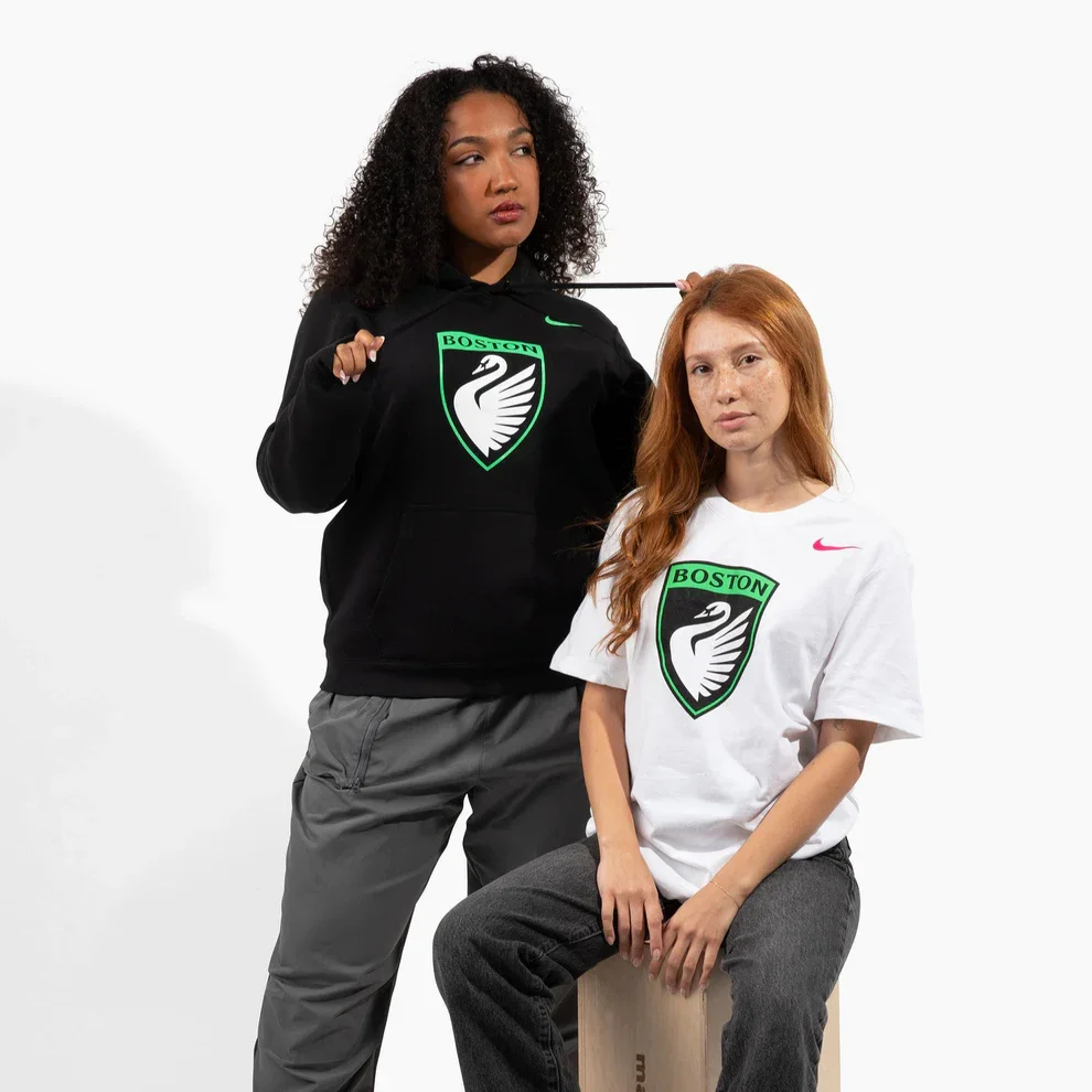 Two women wearing merchandise from Boston Legacy FC