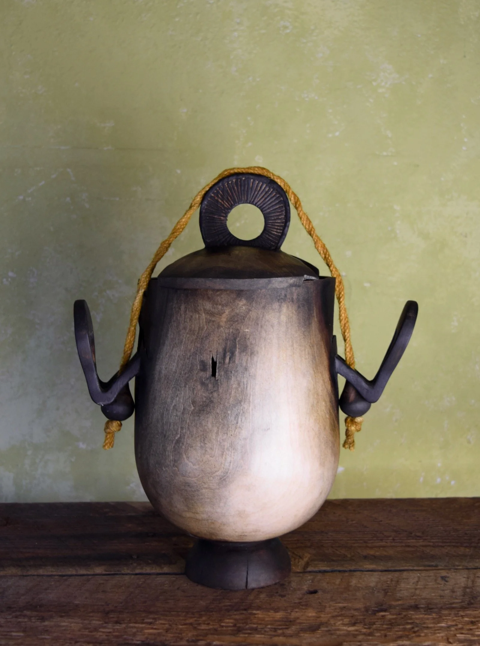 Vas Solaris 

This piece was an exploration of an idea and evolved continuously through its creation. Motifs of sunlight define the carving and rope details and are enhanced by the yellow and black patina across the surfaces. I also learned quickly t