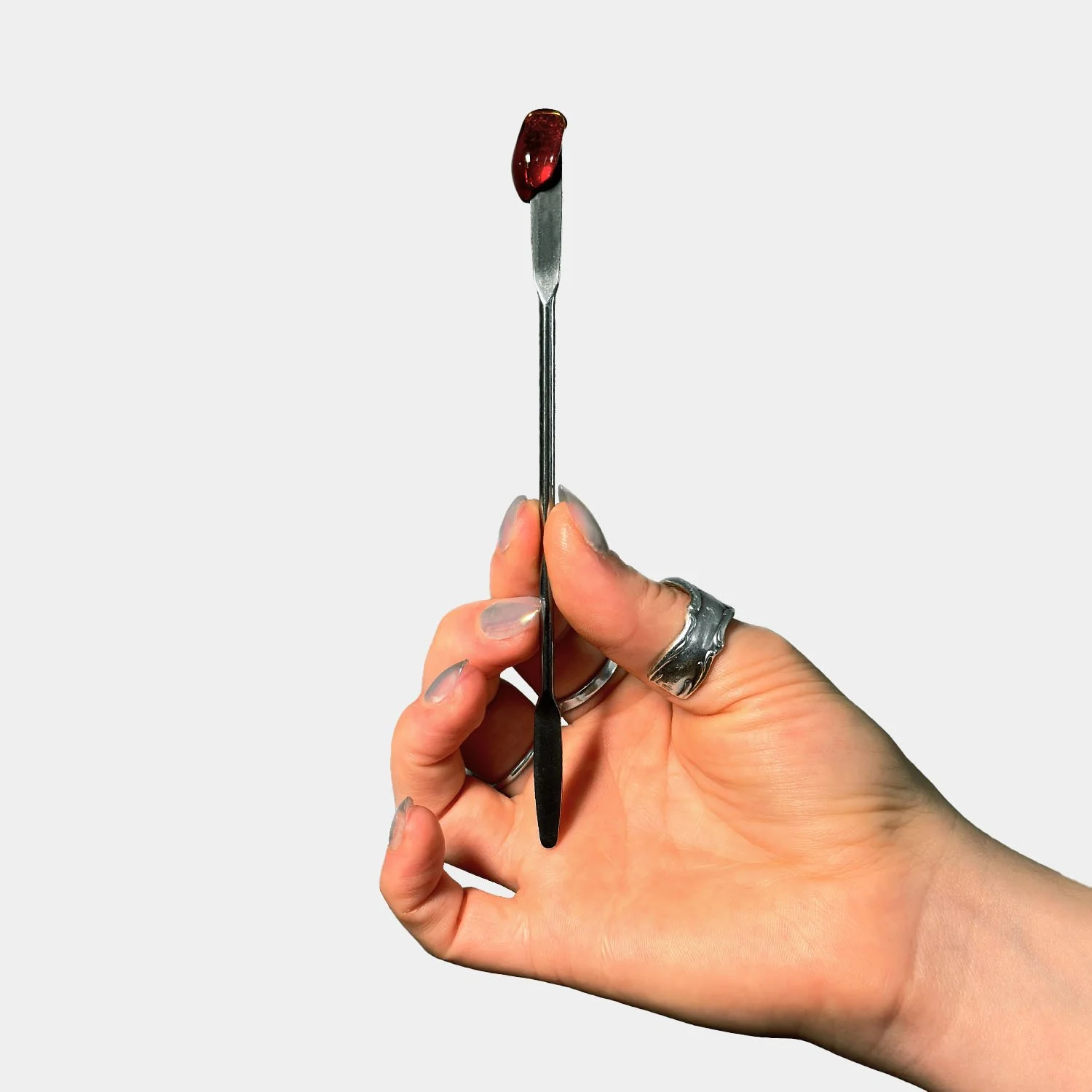 Applicator in hand with sugar wax.jpg