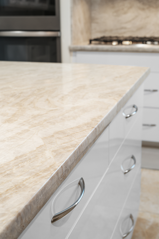 Taj Mahal Polished Quartzite countertops with bookend laminated edge