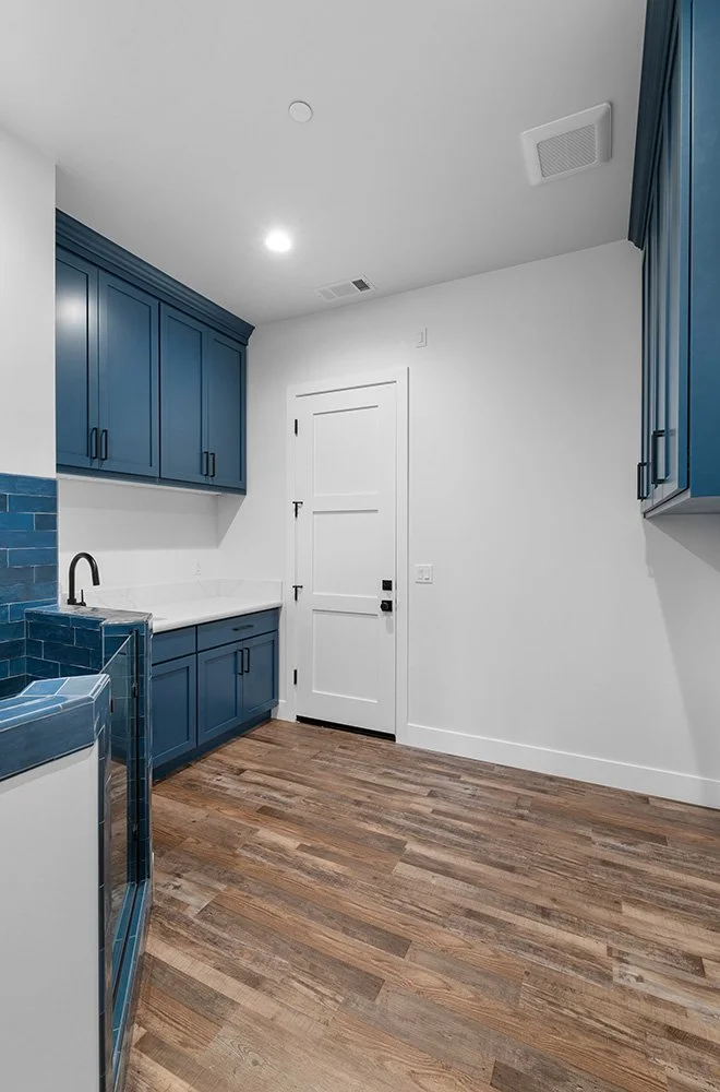 blue cabinets laundry room