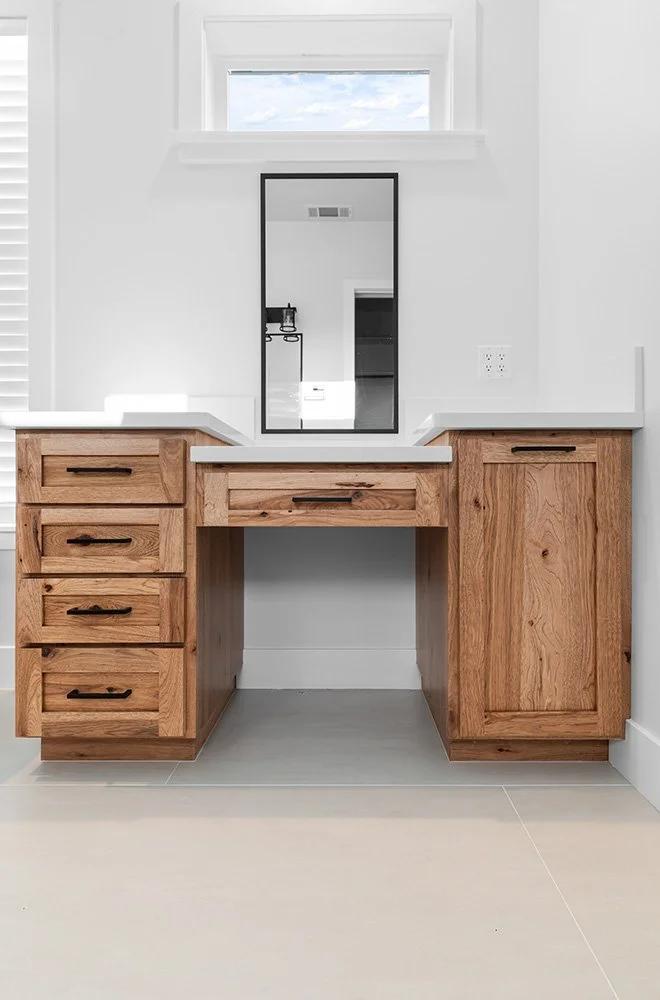 wood bathroom vanity with black fixtures