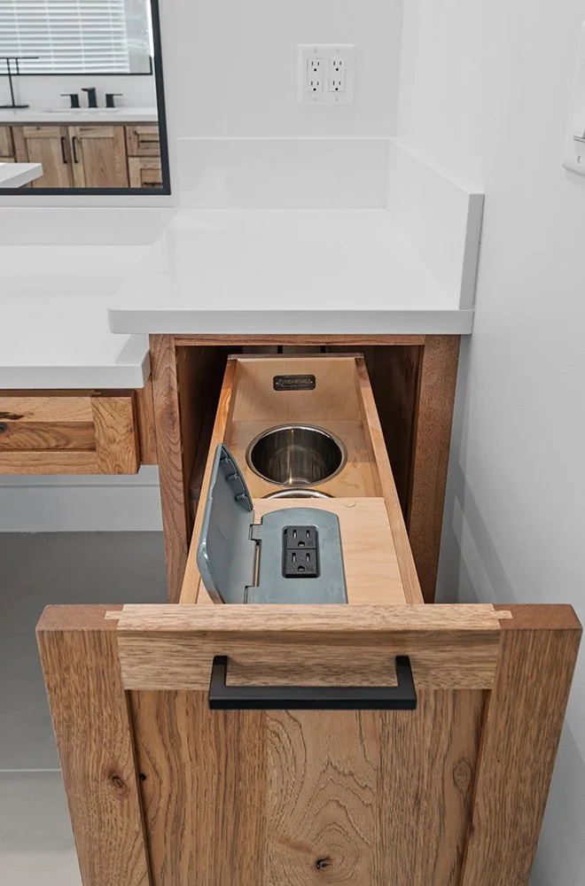 wood bathroom vanity with black fixtures