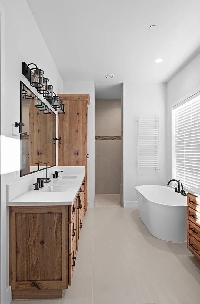 wood bathroom vanity with black fixtures
