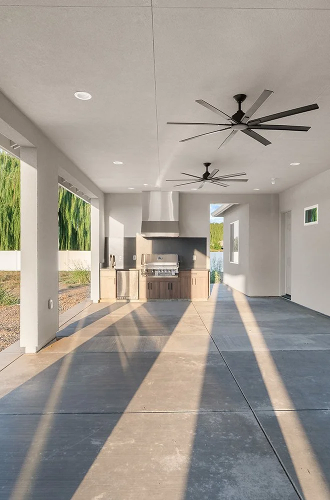 large back yard patio with custom outdoor kitchen