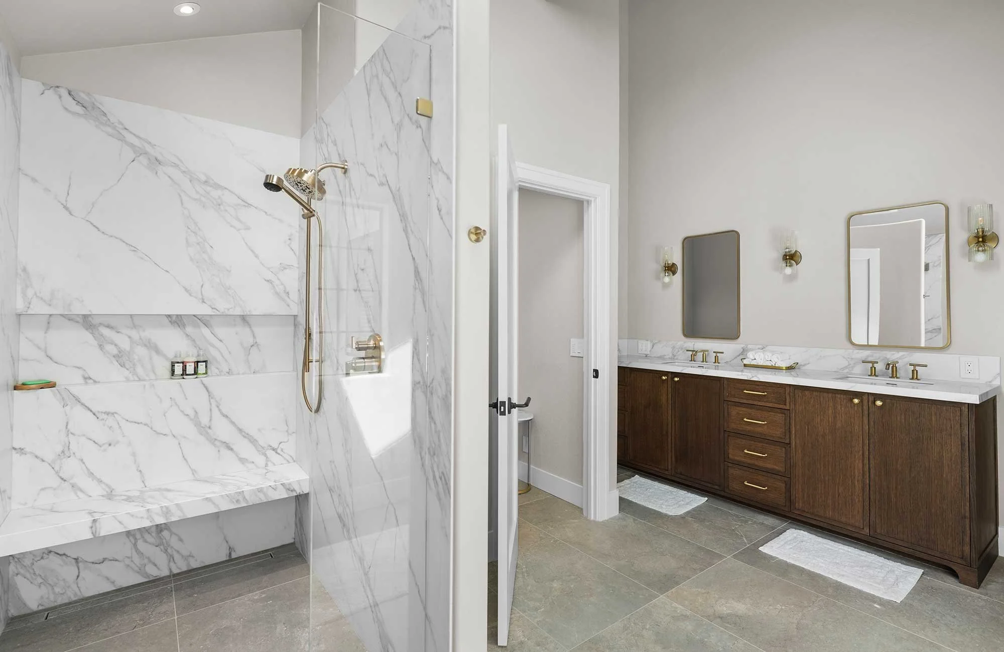 A marble bathroom remodel in redding ca with a slab shower and renovated closet