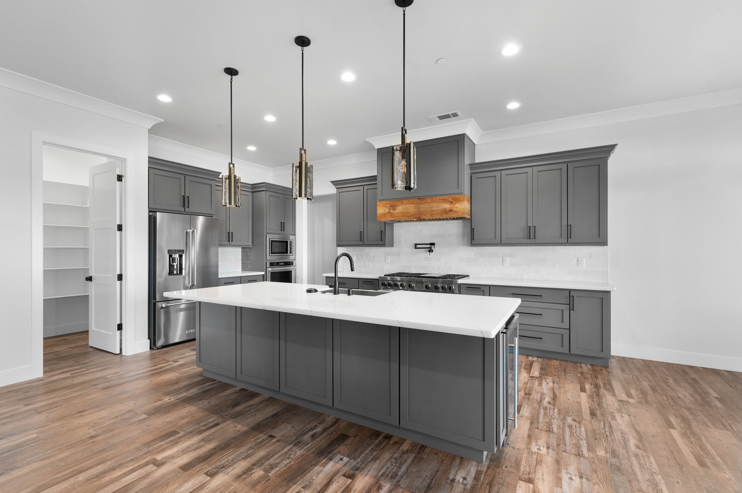 Gray and white modern kitchen with wood accents