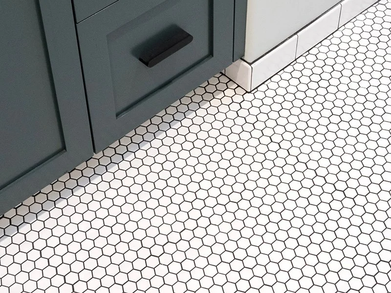 Mosaic tile flooring in bathroom remodel installed by tile contractor in Redding