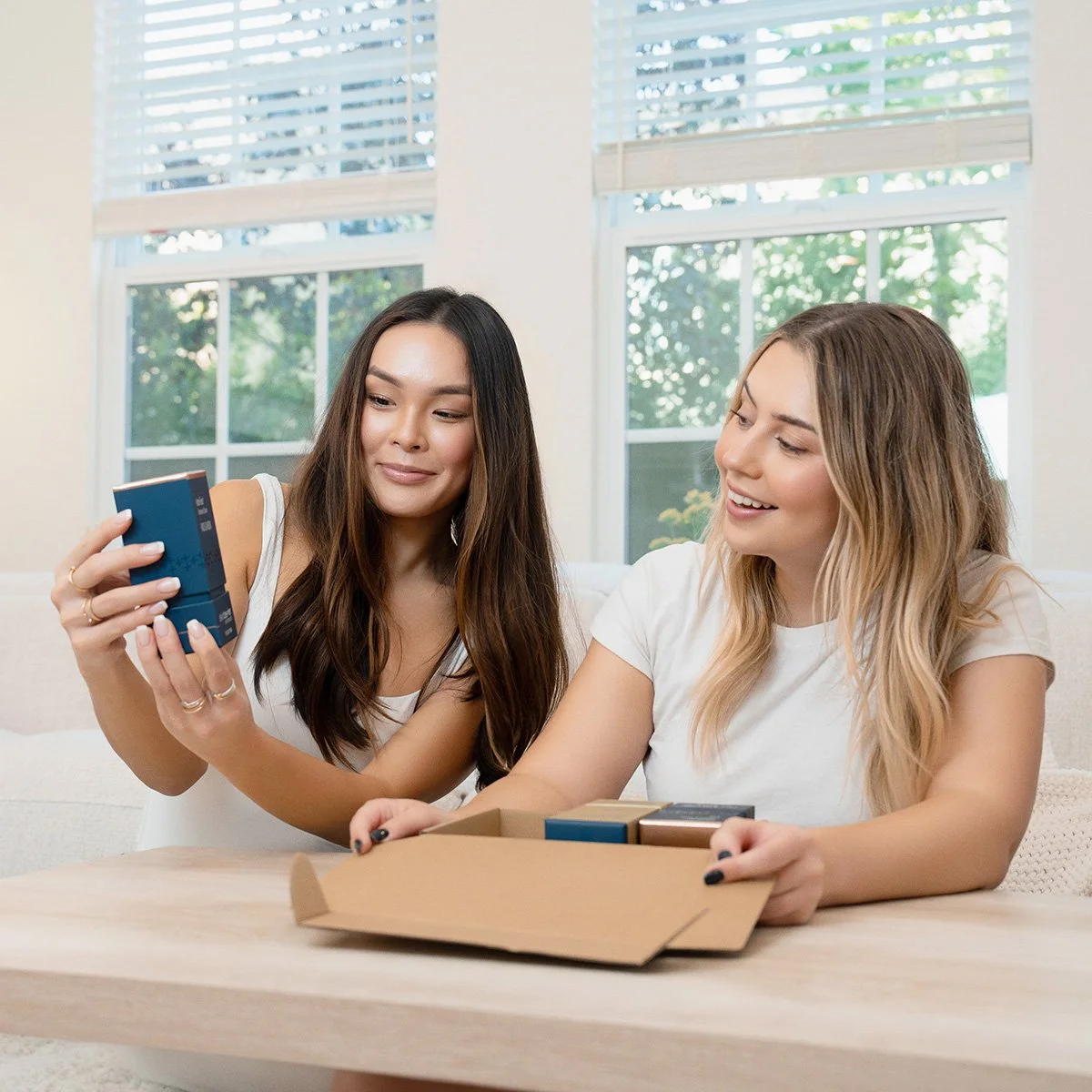 True Skin Beauty concierge members opening a box of skin care products