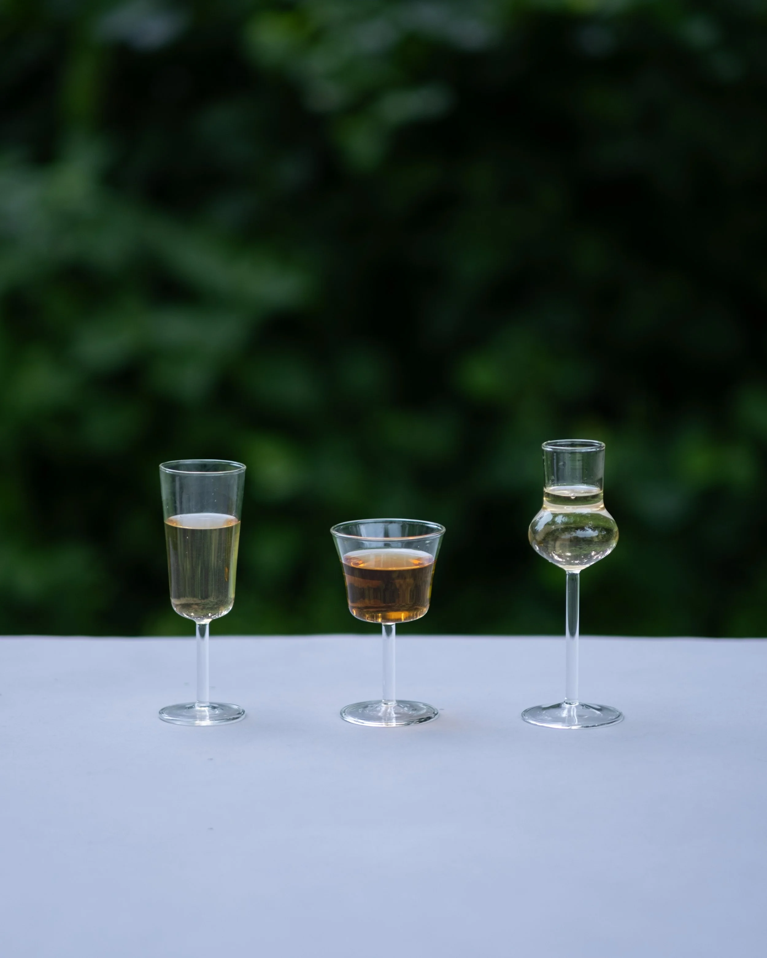 Three glasses of Chinese tea showing the color and clarity of the Summertime Tea Collection