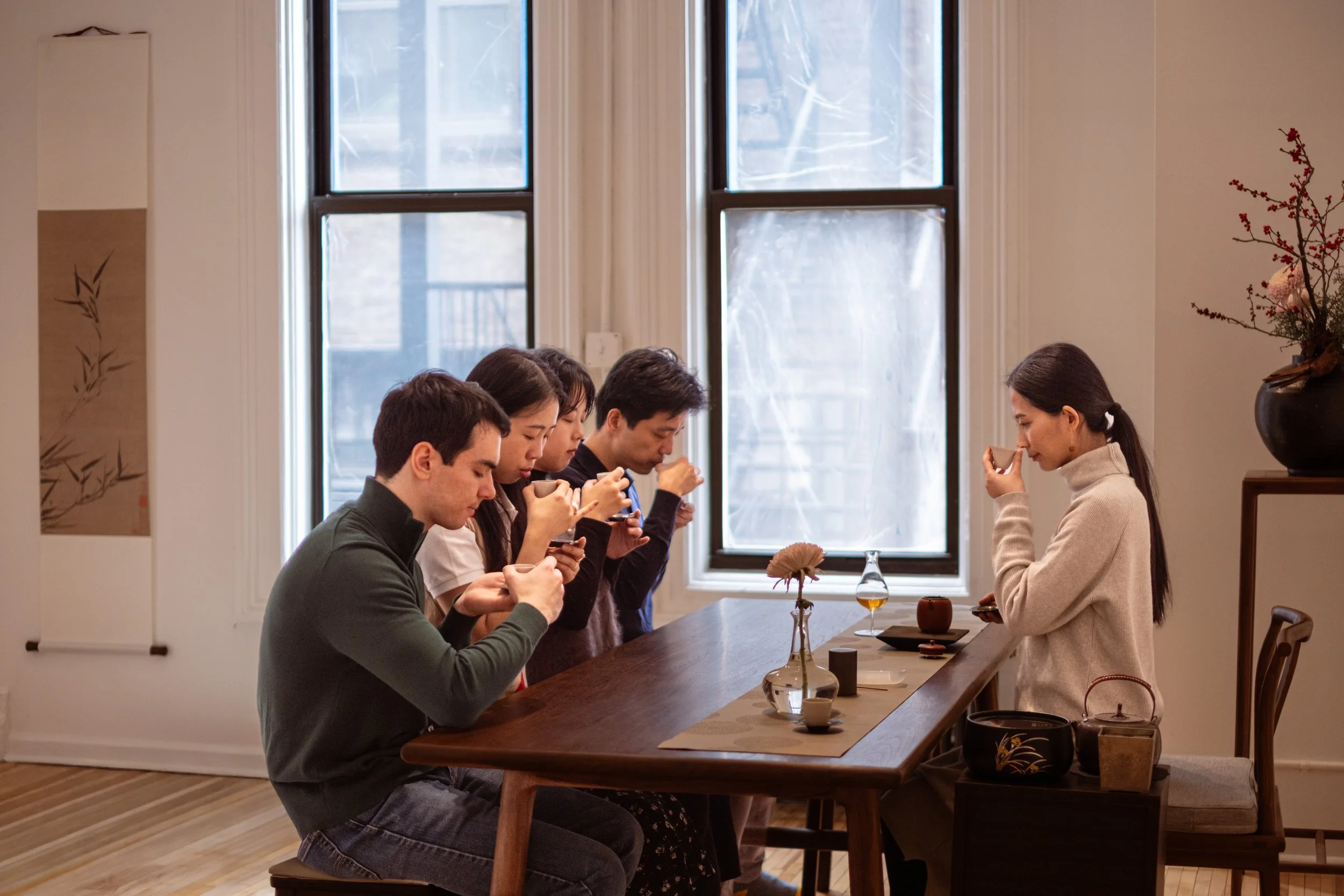 Mengyan Gong and four guests smell the aroma of Chinese tea during a private tea ceremony at Teasthetic's NYC Tea Studio.