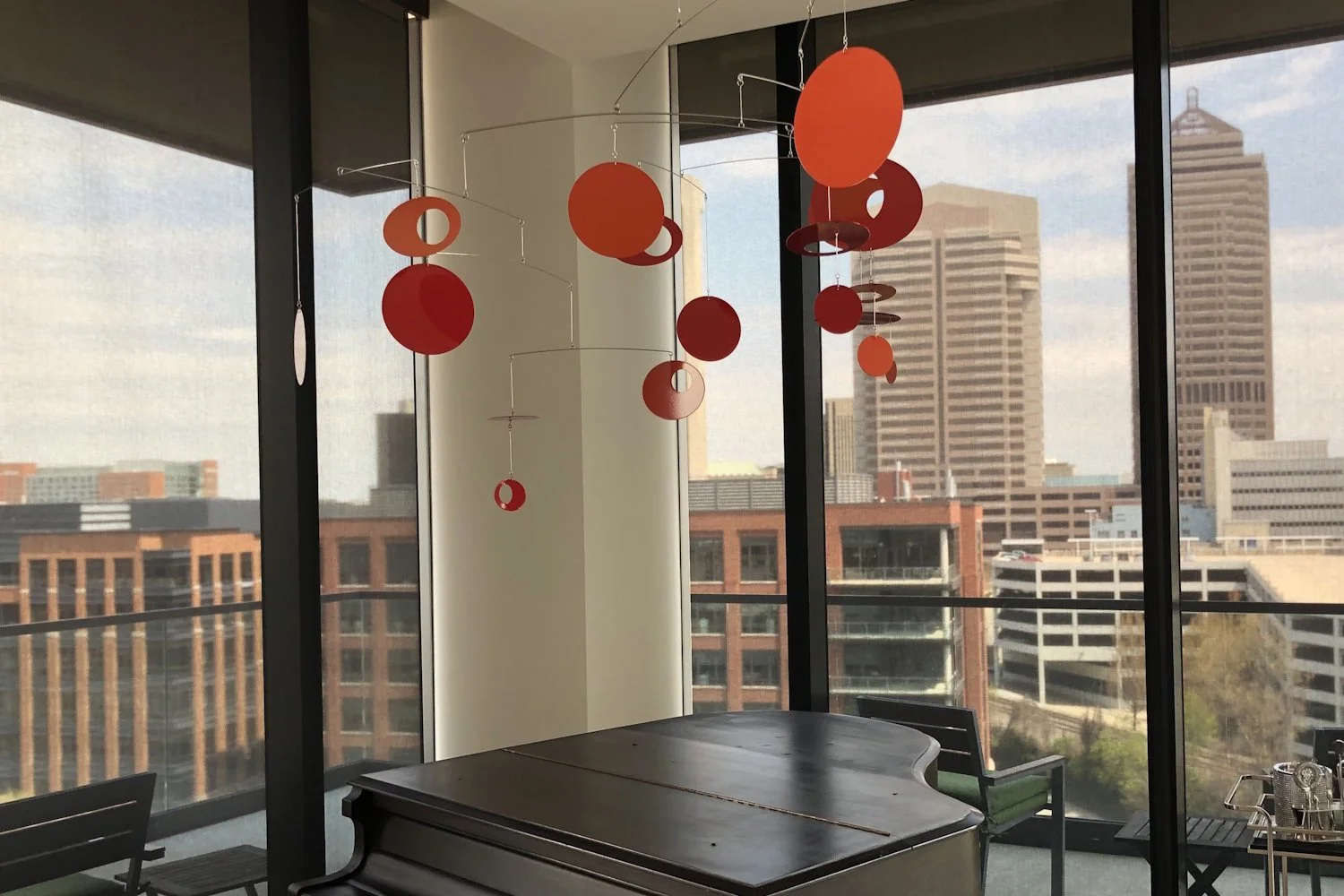 red hanging mobile in glass high rise .jpg
