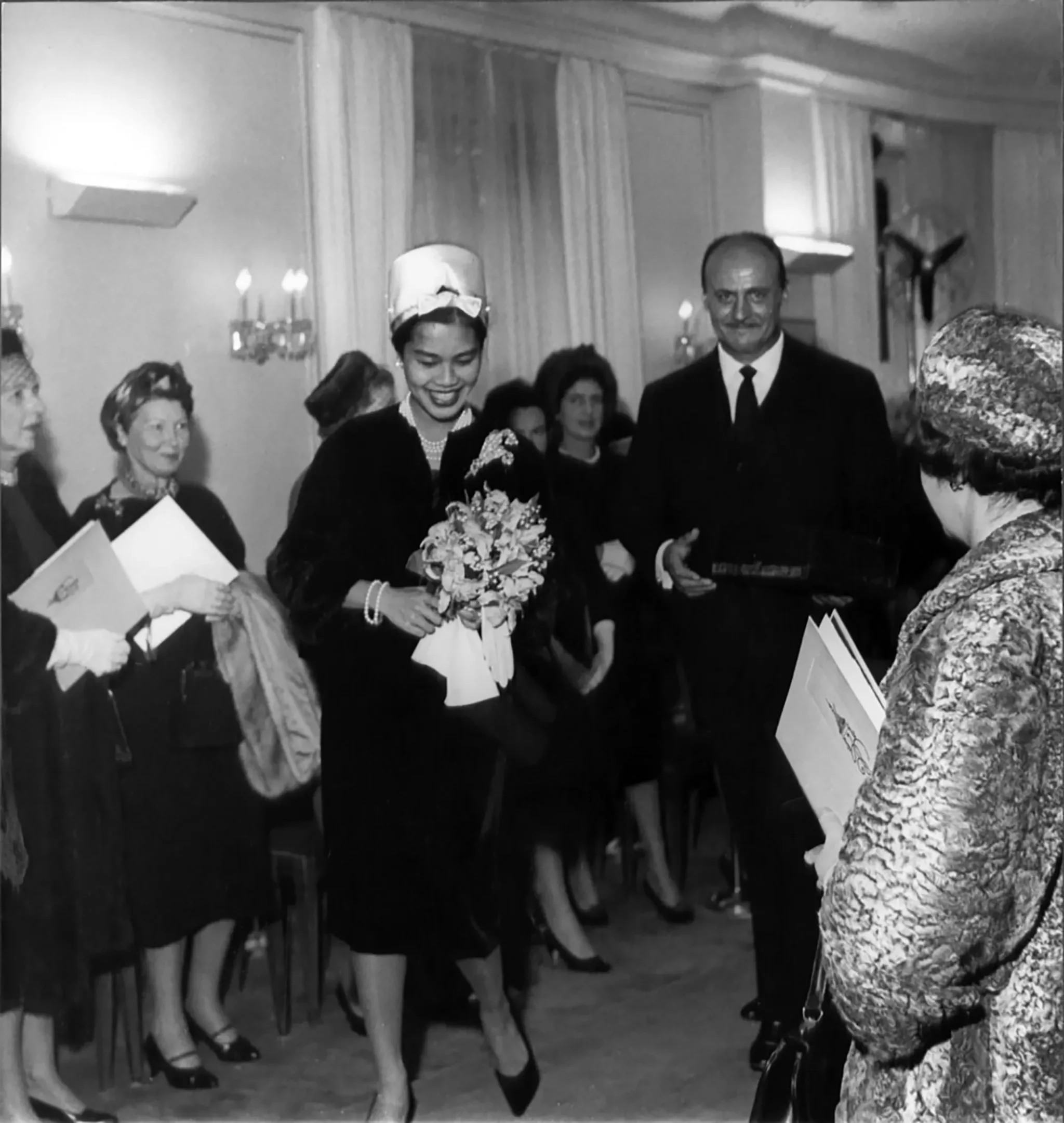 Pierre Balmain and Queen Sirikit at Maison Balmain in Paris, 1960