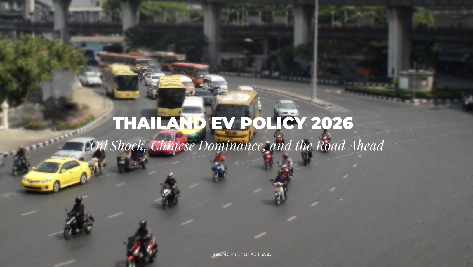 Bangkok traffic intersection dominated by motorcycles, buses and taxis — a scene the Thai government's 30@30 EV policy aims to transform by 2030