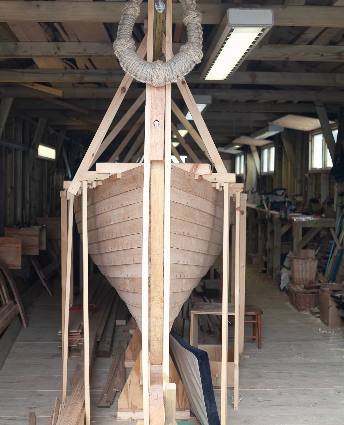 Professional commercial photography of gig boat being built in Lyme Regis, Dorset, by Gail McGarva