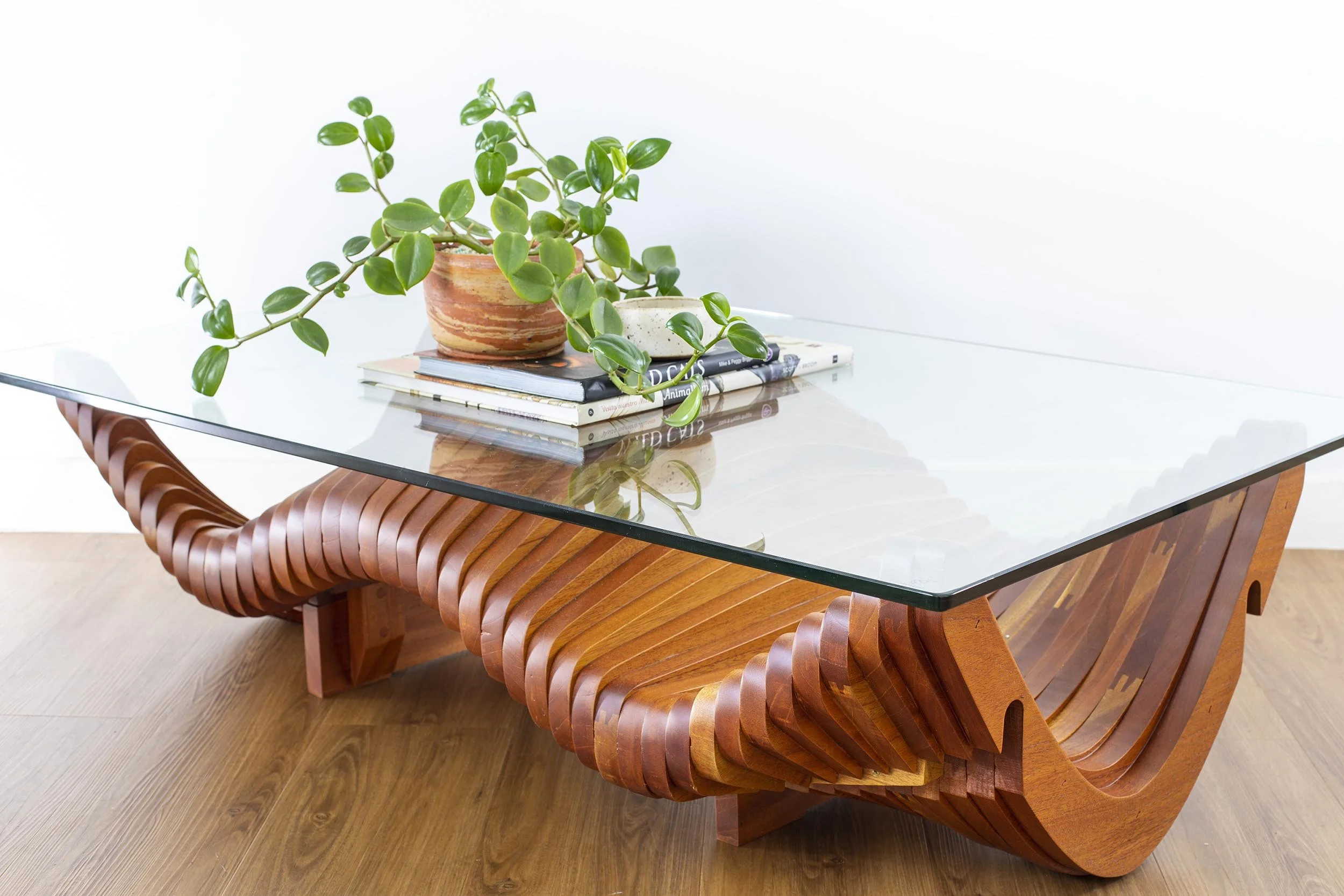 Custom sculptural wood furniture piece handcrafted in Costa Rica—example of dining tables, benches, consoles, and statement pieces.