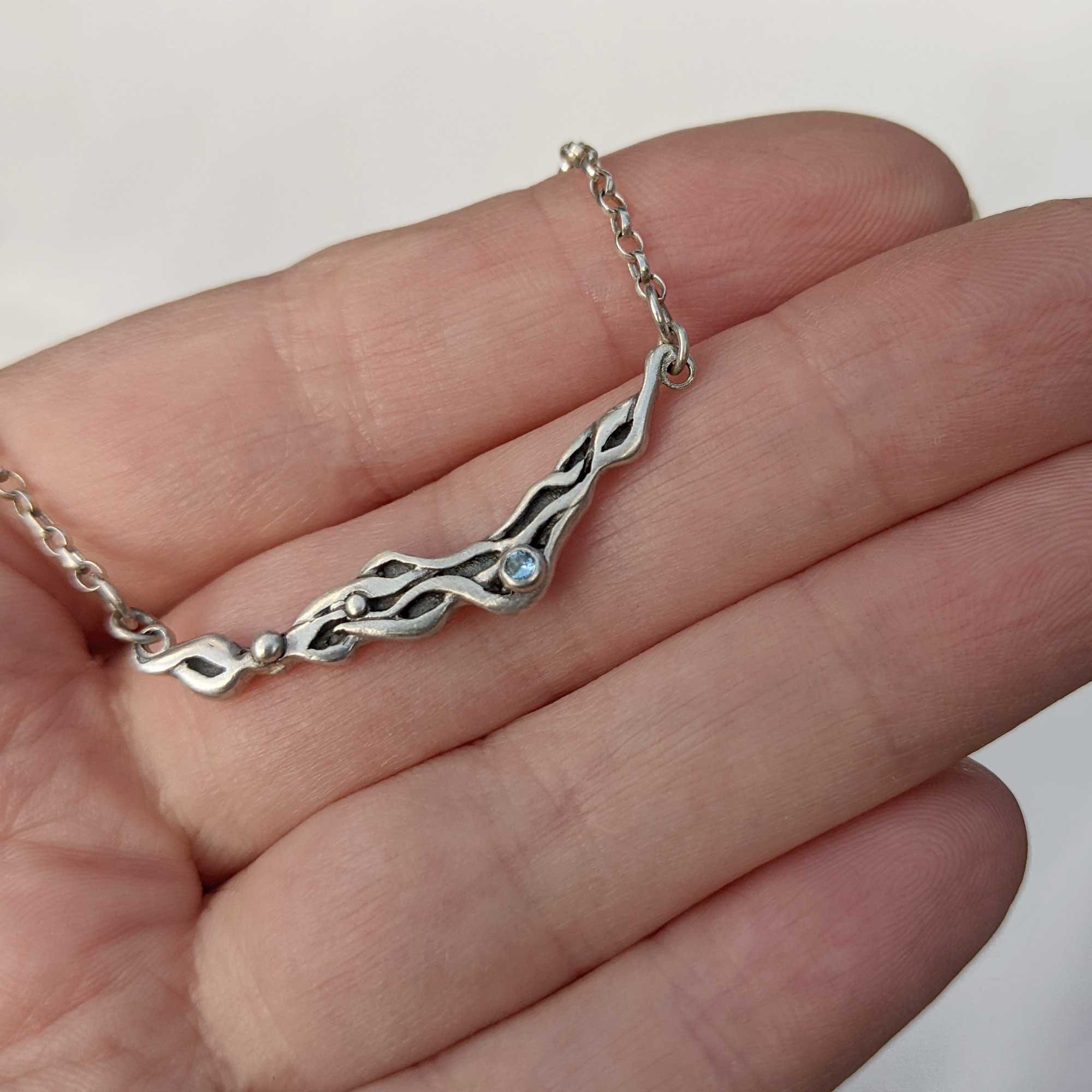 Ebb_Flow_Aqua_Neck_hand_2_.jpg