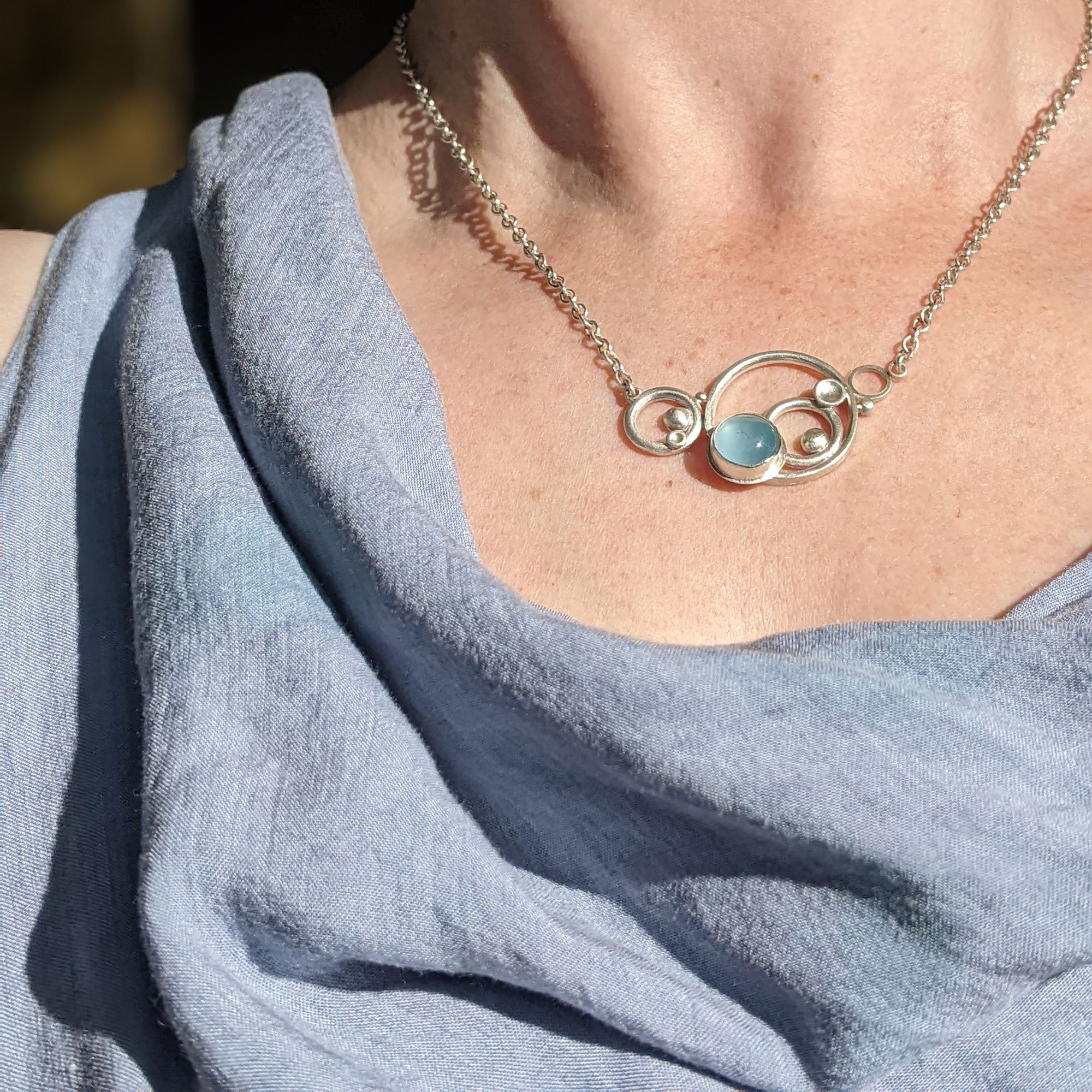 Aqua_Med_Circles_Neck1_worn_.jpg