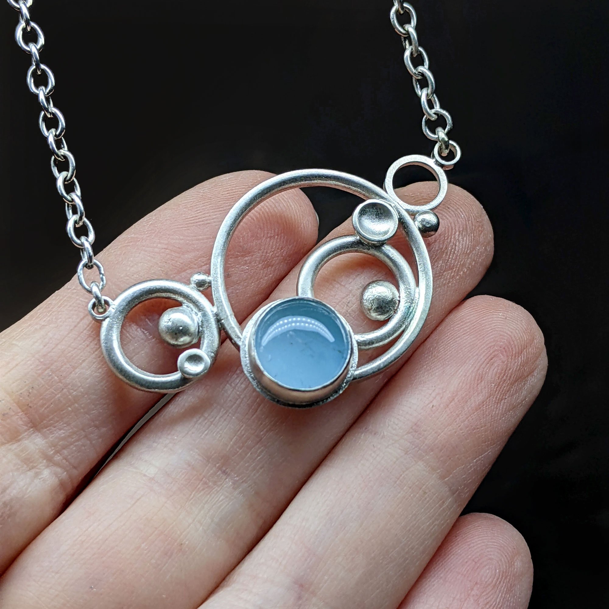 Aqua_Med_Circles_Neck1_hand2_.jpg