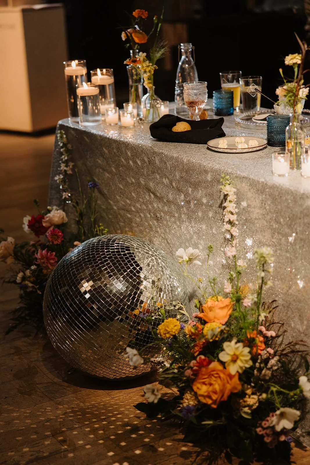 Canmore wedding reception florals. Photo by Miranda Anderson