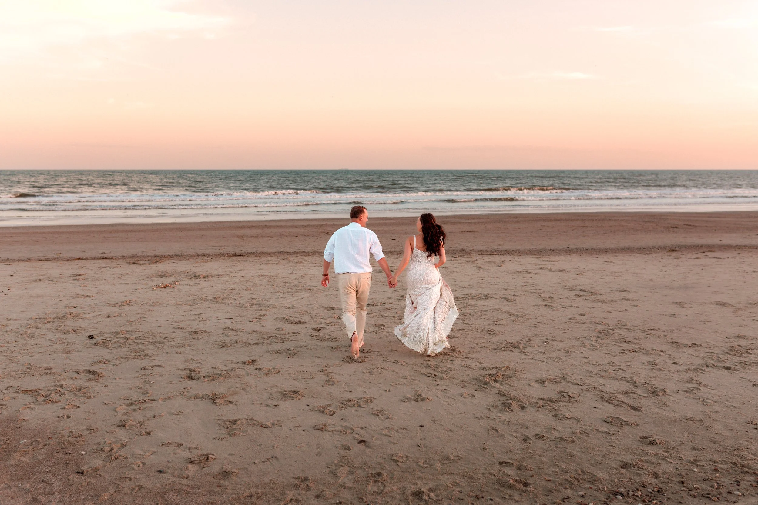 Couple running on Folly Beach