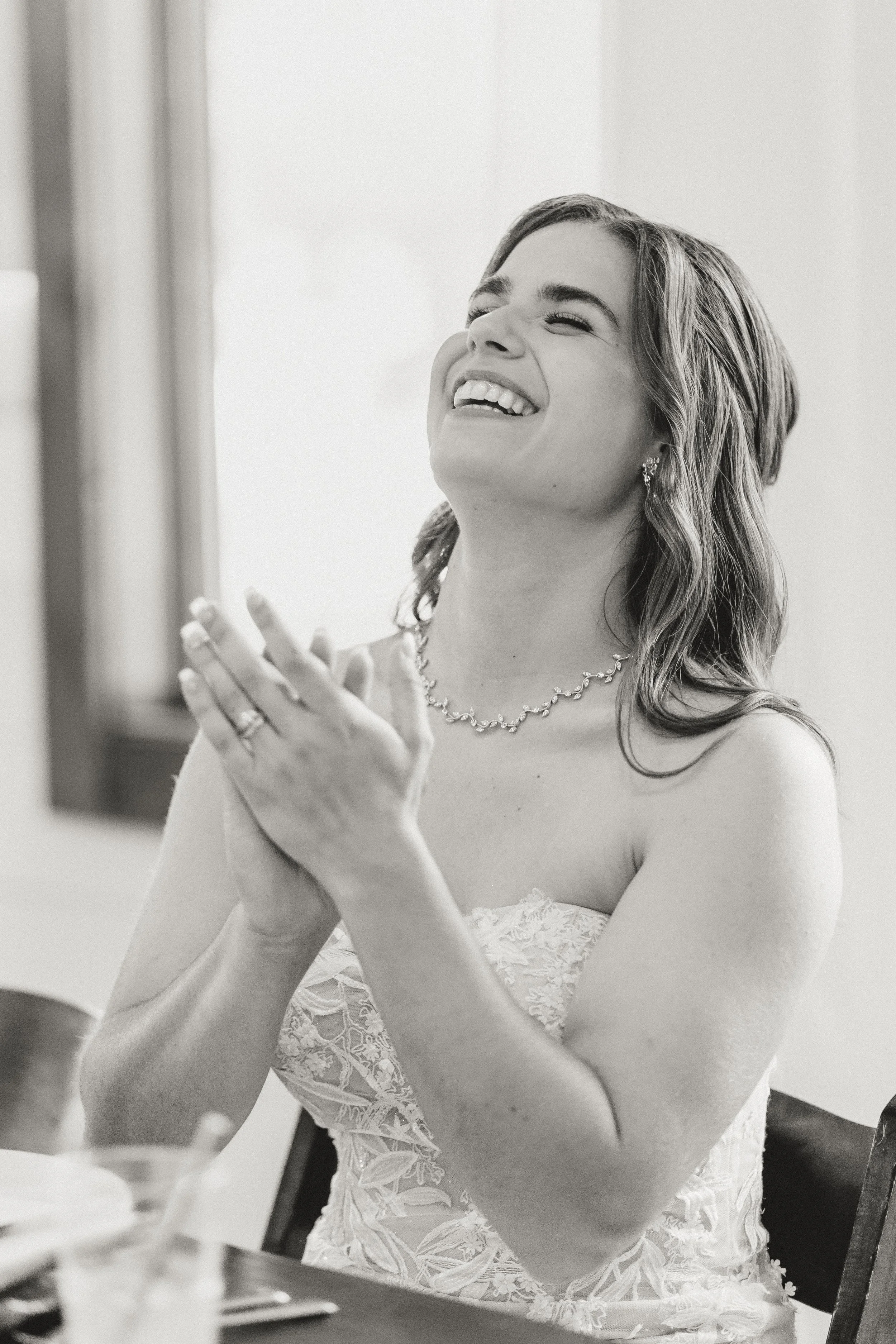 Candid bridal portrait capturing joy and emotion during wedding day