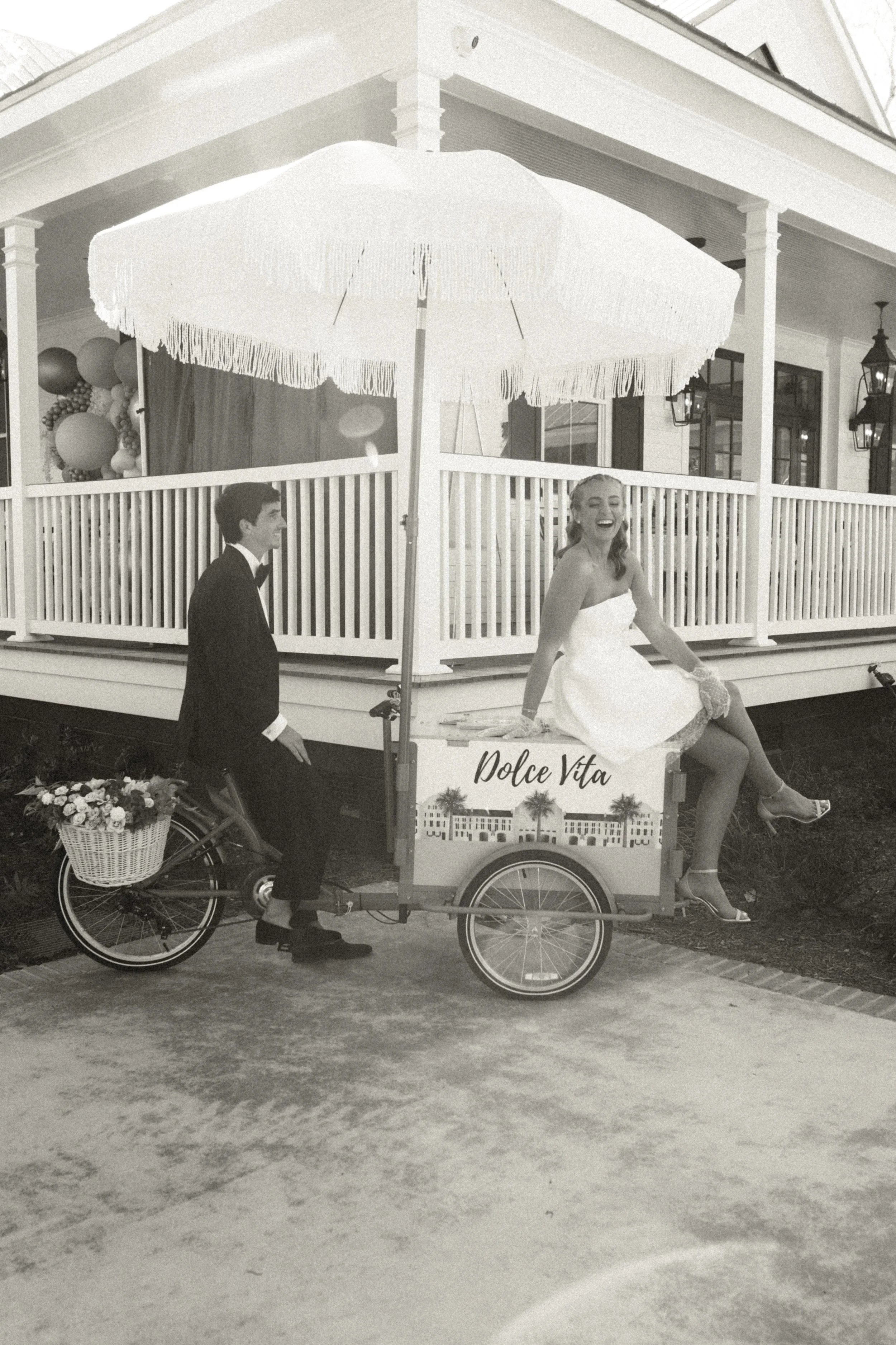 Black and white documentary wedding photograph capturing a timeless candid moment