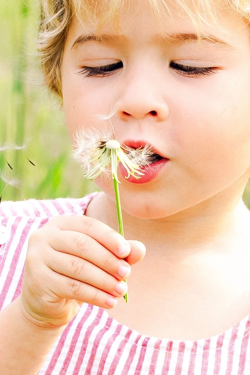 Close-up child portrait capturing soft natural light and candid expression