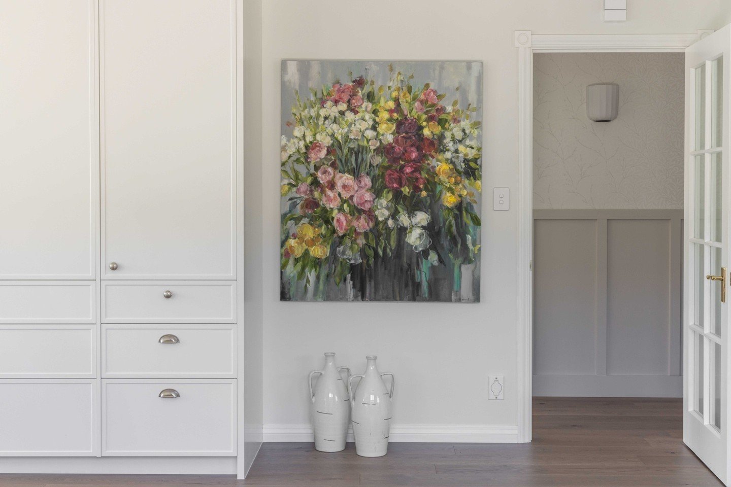 Loving this gorgeous pop of colour by #melaniehammettart in one of our recent renovations. ⁠
The colours complement the serenity of the colour scheme and bring interest to this space 💐⁠
⁠
📷️ @hazelredmond_⁠