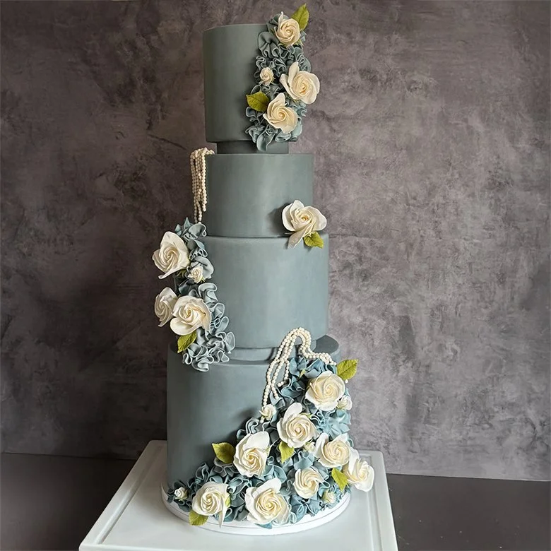 Dusty blue cake with roses copy.jpg