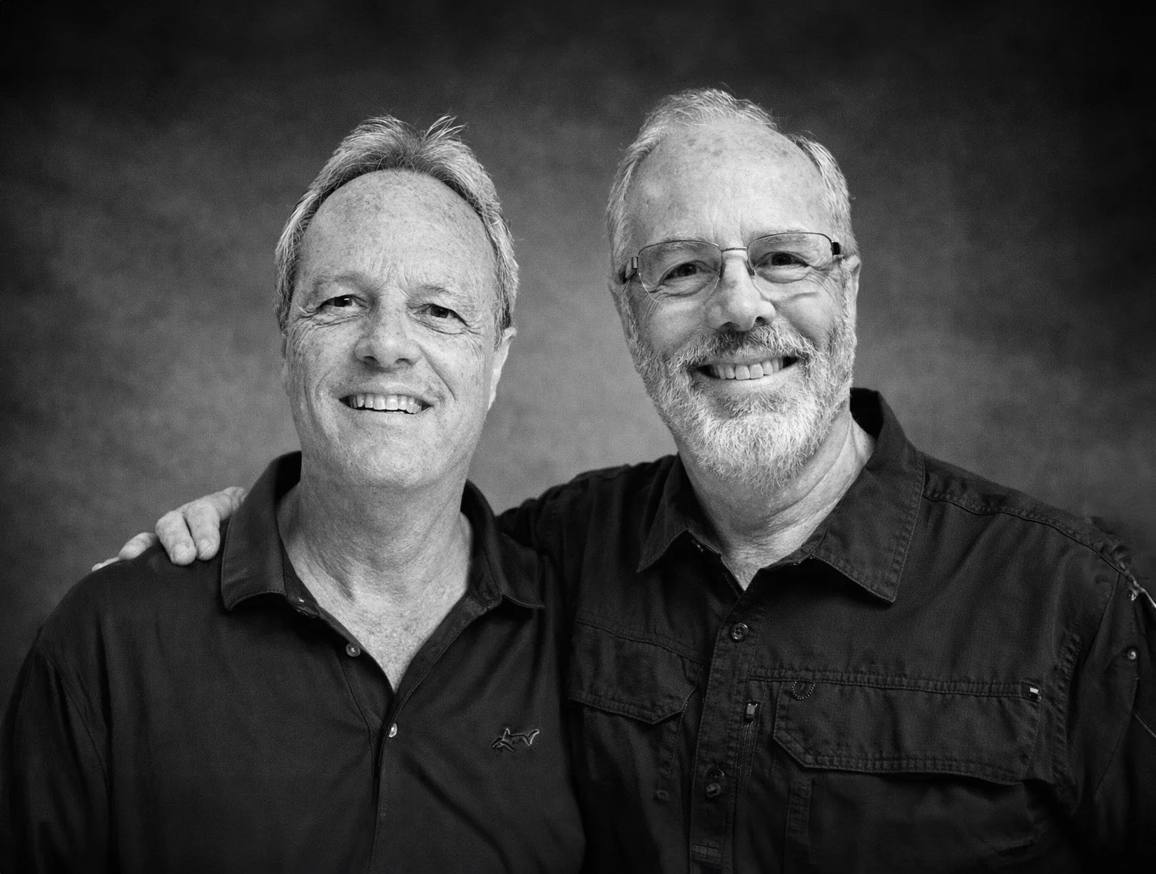 Two middle-aged brothers and owners of local sign company