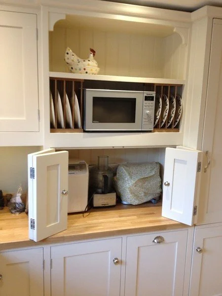 Marc Smith bespoke breakfast station cabinet containing plate storage and space for small appliances.