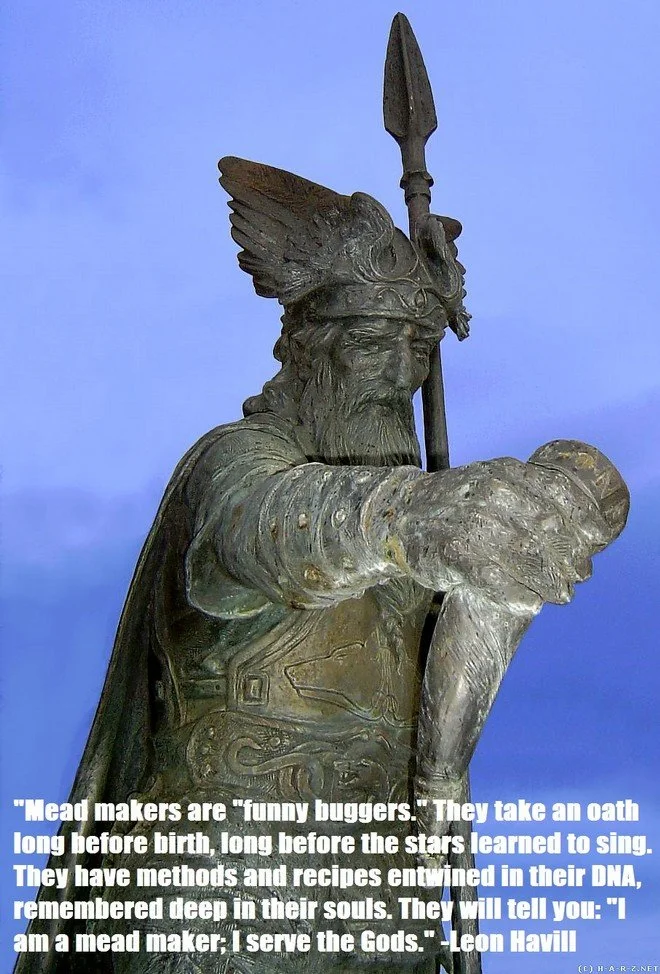 Statue of a Viking warrior with a horn, featuring a quote about mead makers by Leon Havill at the bottom.