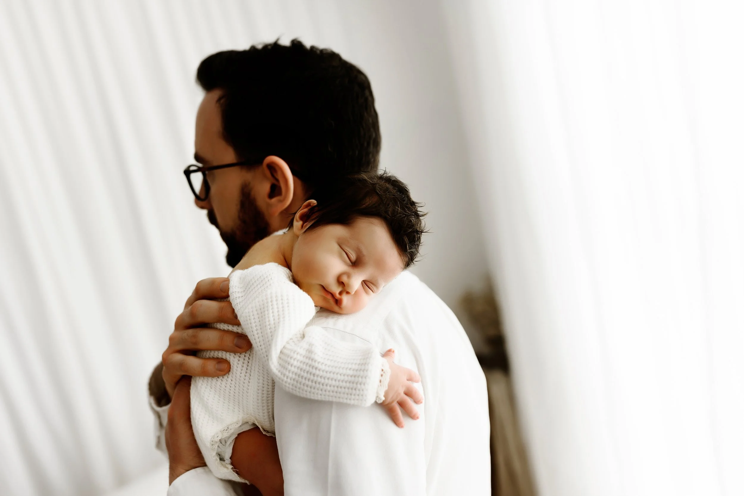 Newborn baby girl with her dad