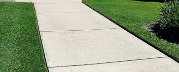 Concrete sidewalk with grass on both sides