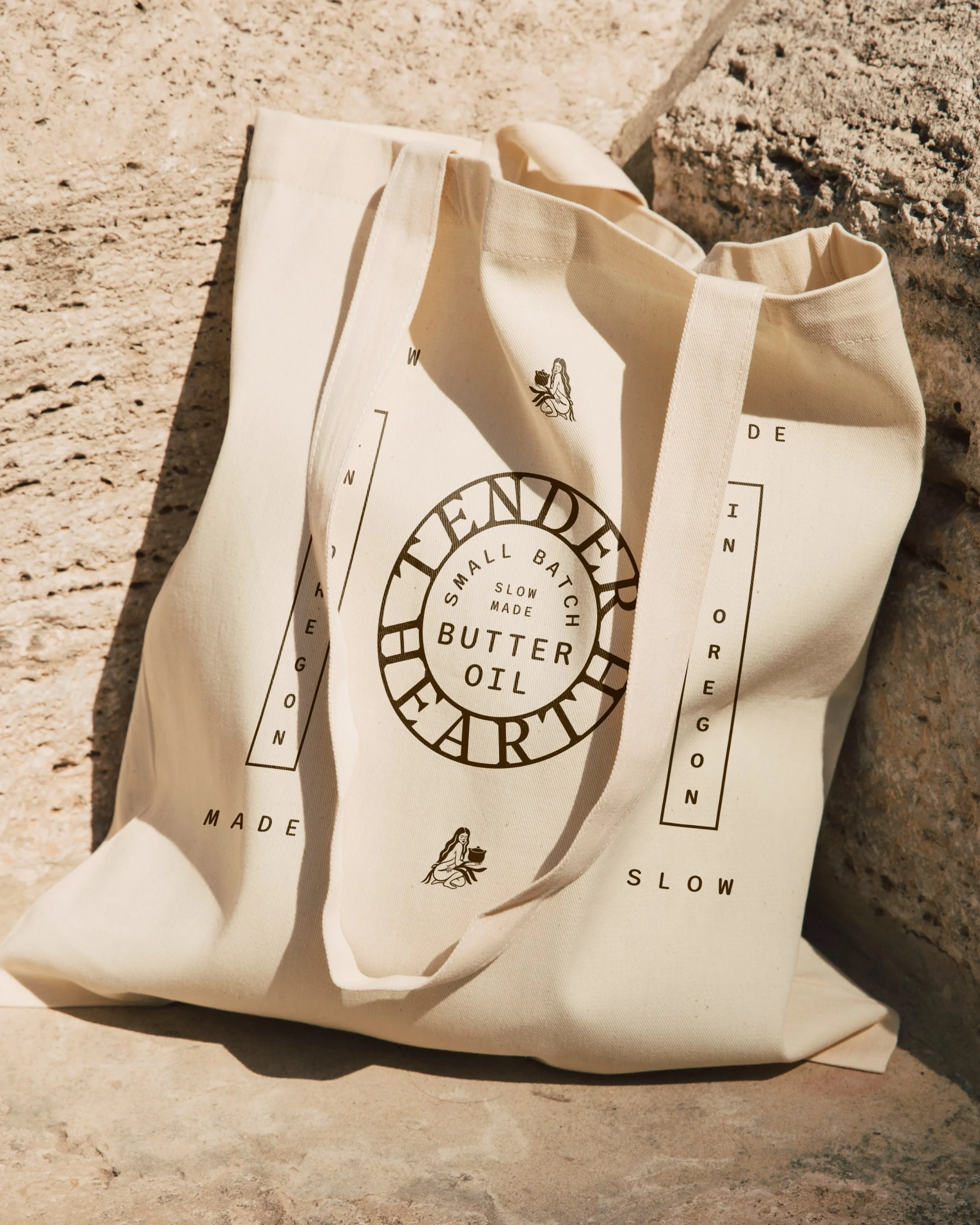 Custom screen-printed textile design for a family-centered brand, utilizing ancestral symbols and textures.