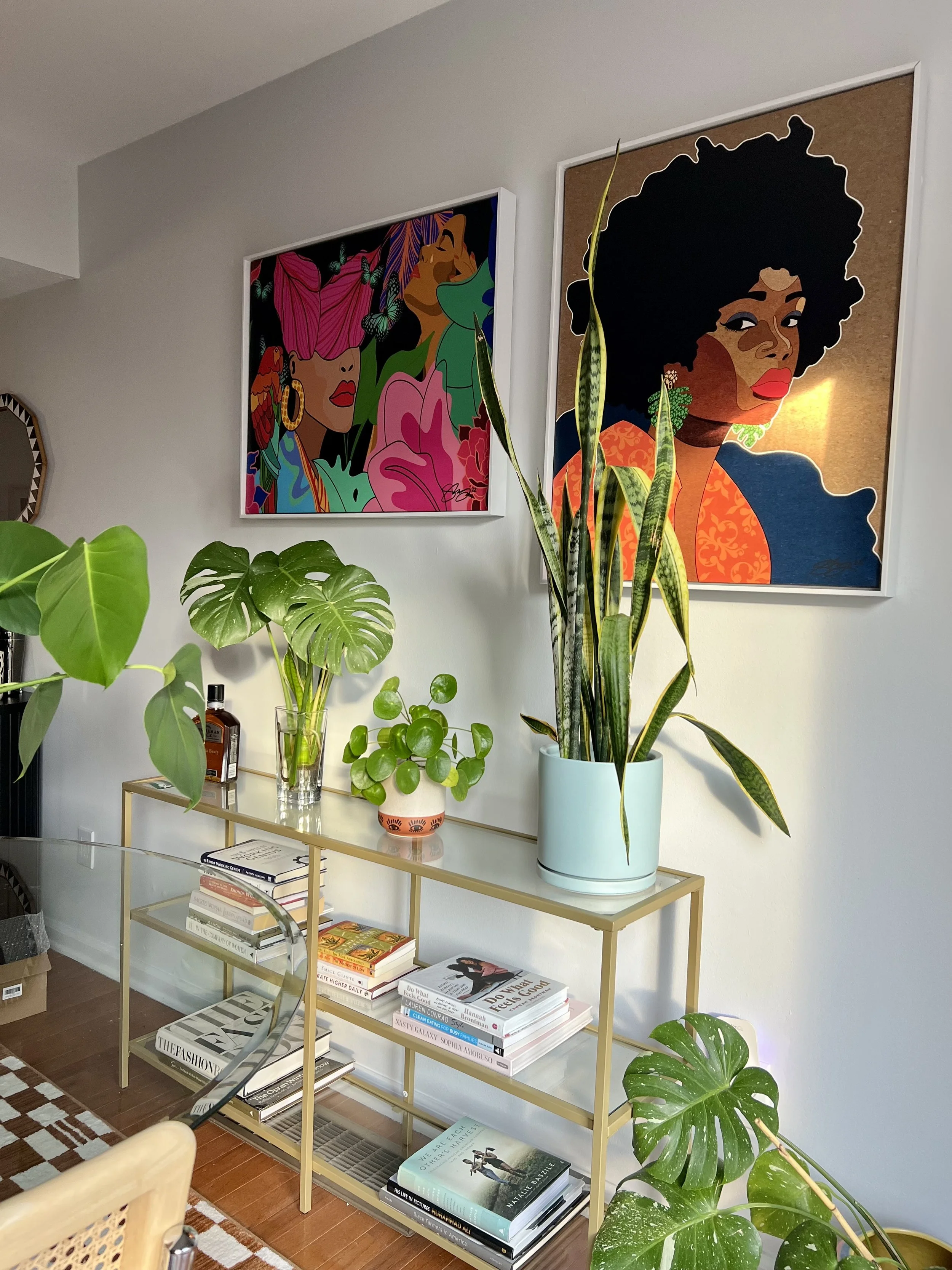 Bright living space styled with houseplants and colorful art