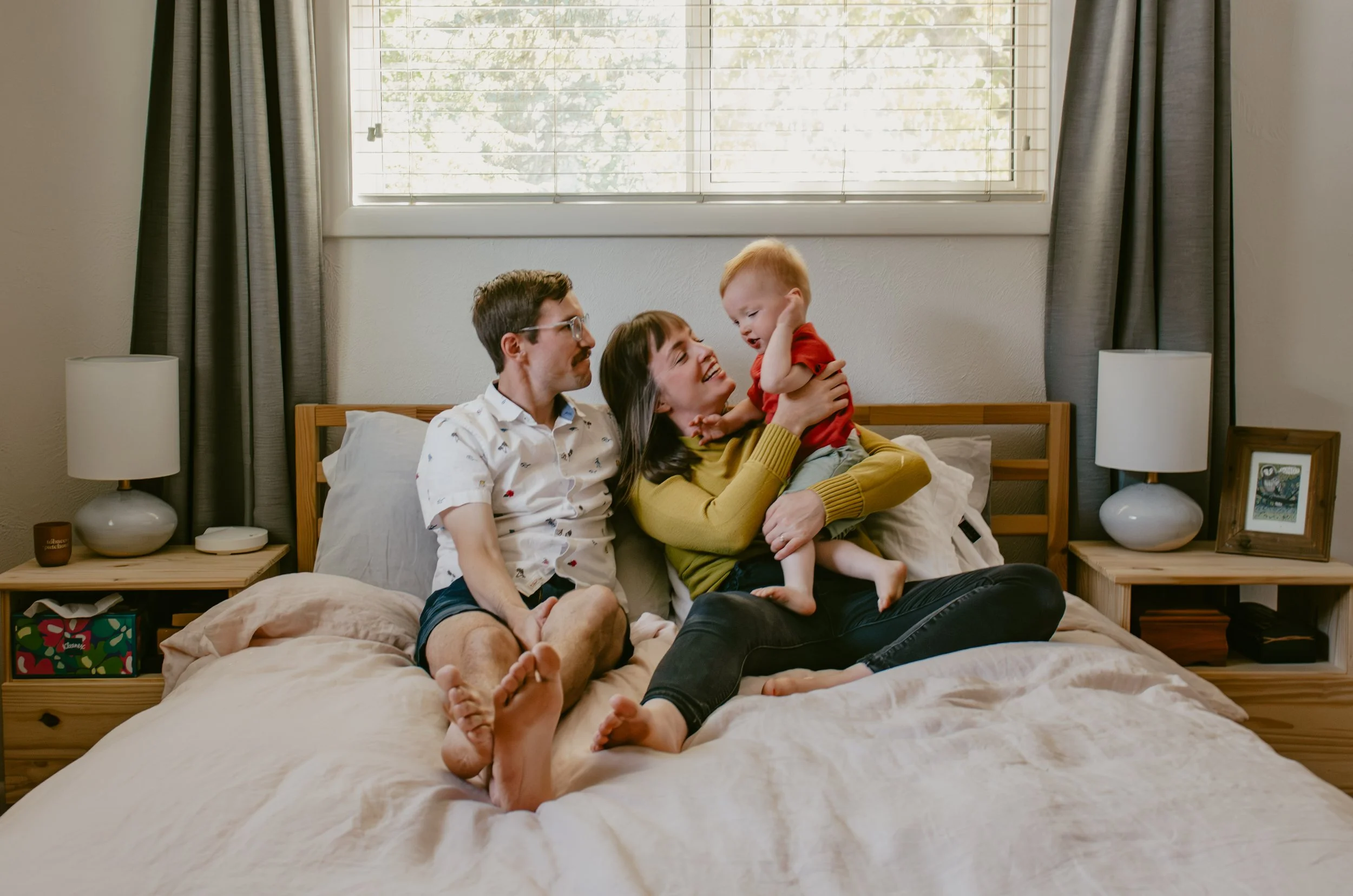 An at home lifestyle family photography session in Salem Oregon of parents and toddler playing 