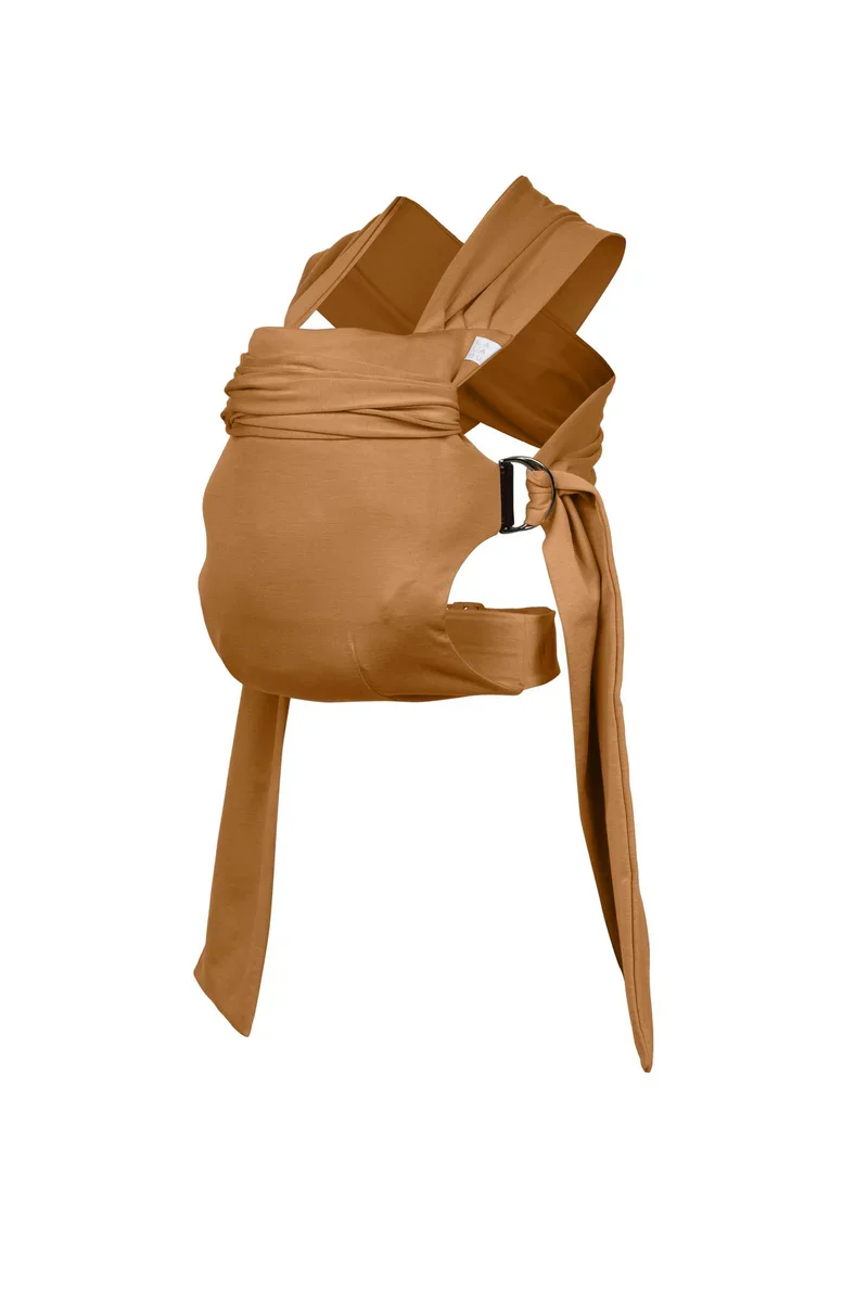 A tan baby carrier with fabric straps and an adjustable buckle.