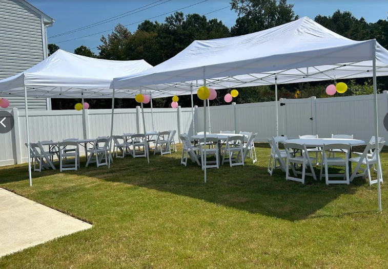 Two 10x20' pop up tents with 2 round tables each