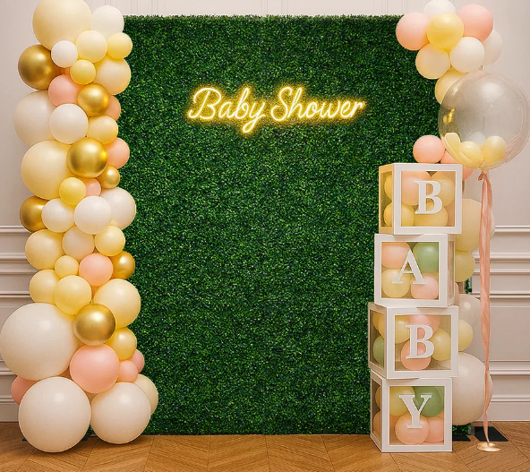 stock photo of greenery wall decorated for baby shower