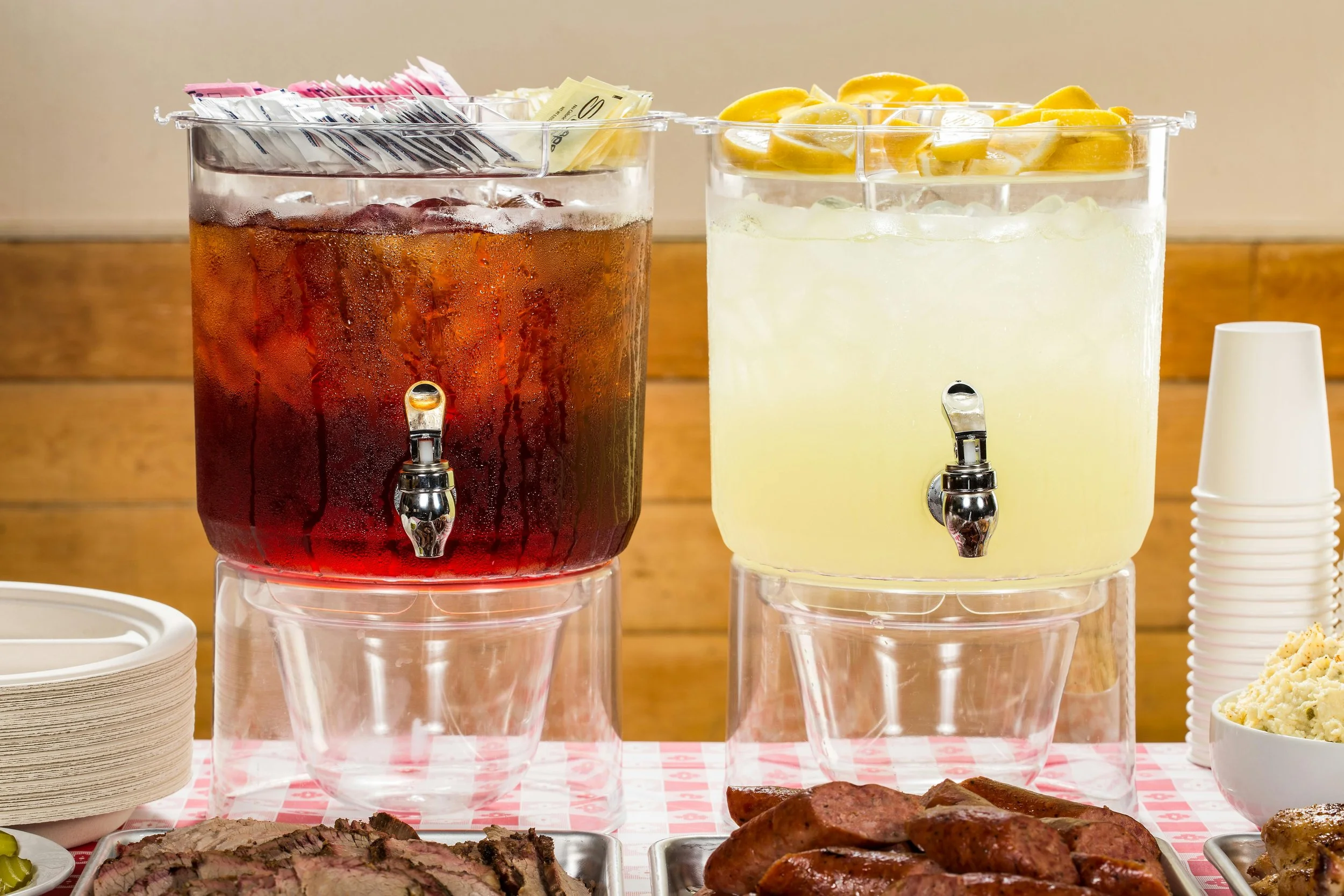 drink dispensers at buffet serving iced tea and lemonade