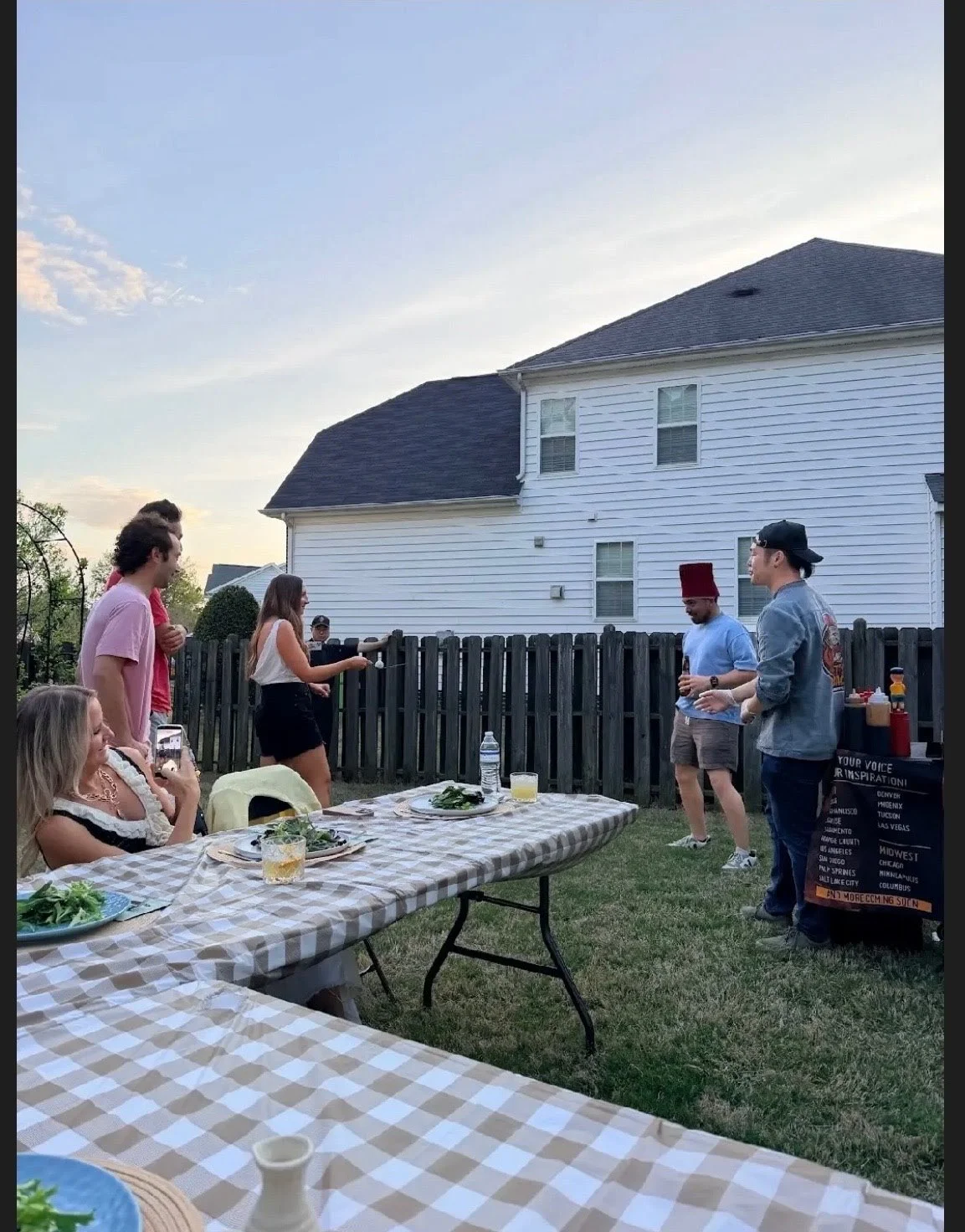 party goers enjoying a backyard hibachi dinner