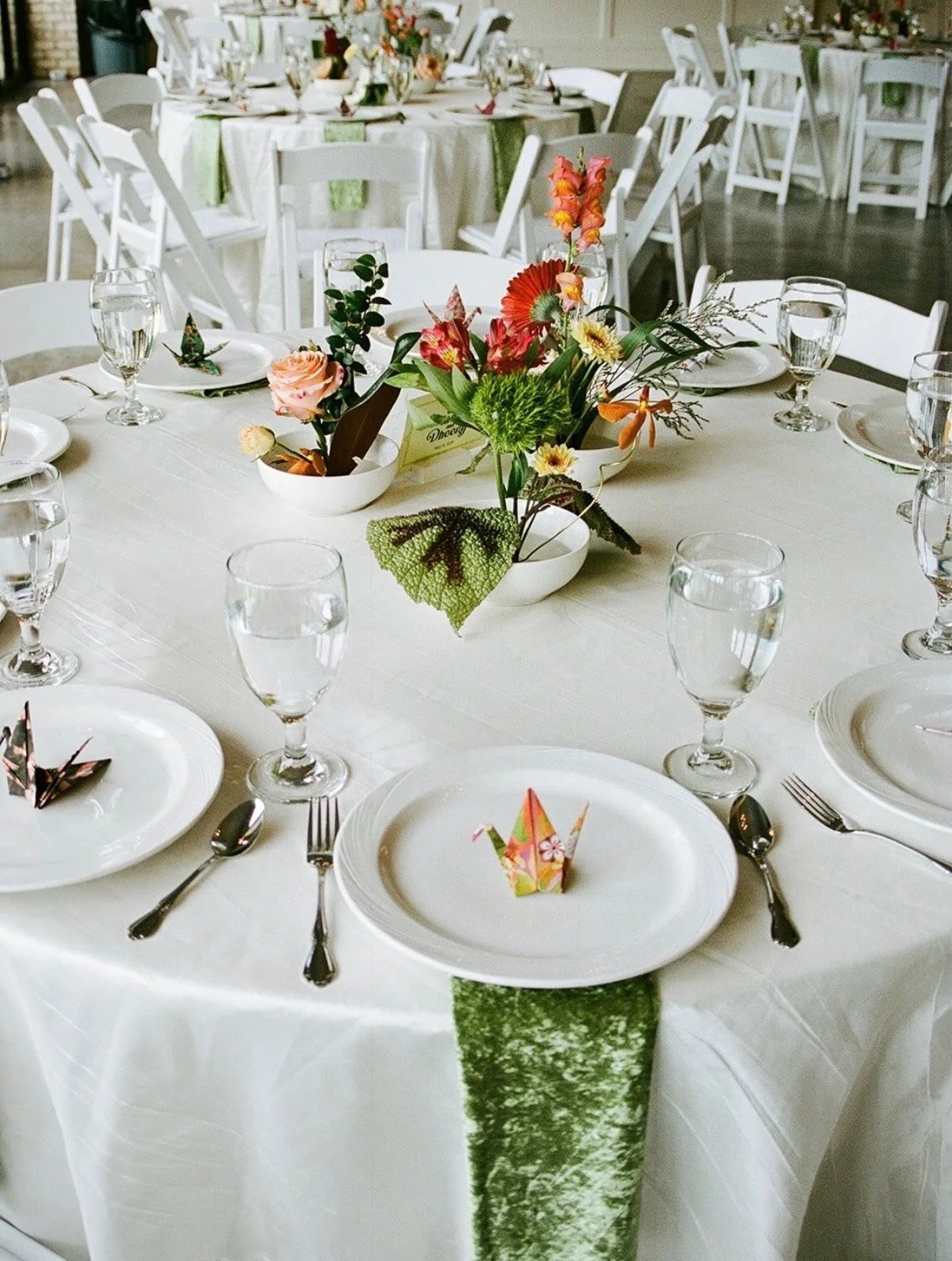 Aerial view of wedding tabletop with tableware and floral centerpiece