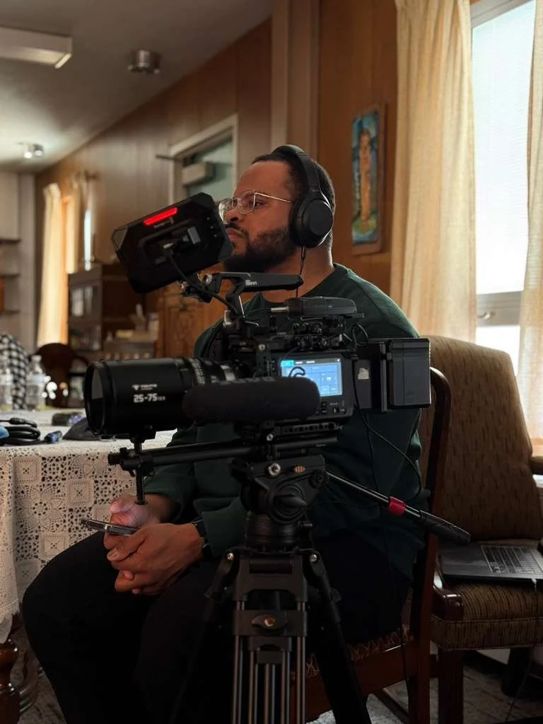 Alex Grant filming an interview at the Motherhouse of OSF Heathcare