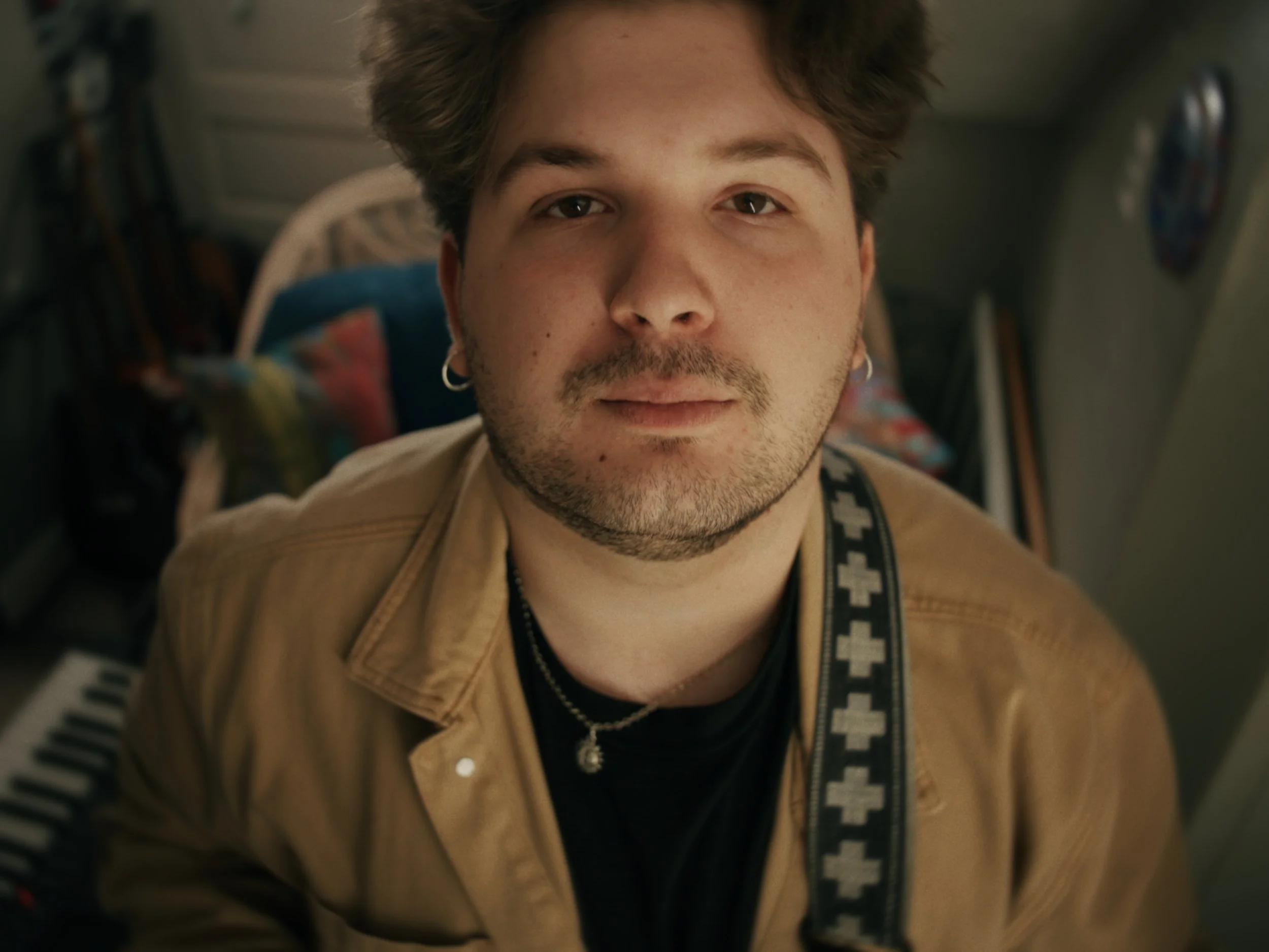 Tyler Armstrong of Scorched Waves looking into camera. 