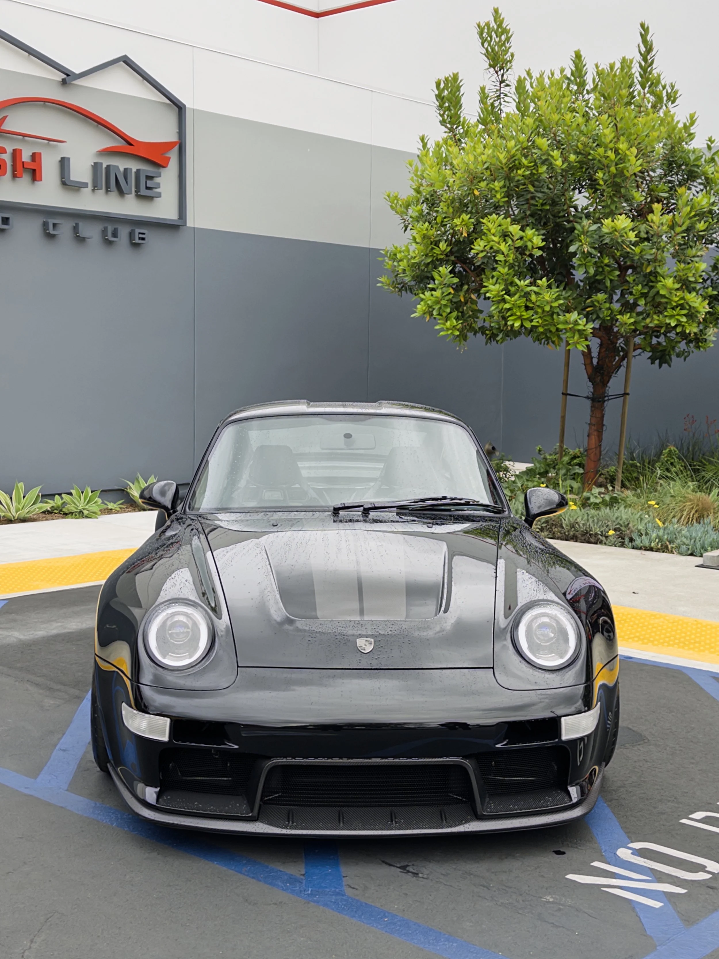 Turbo Florio 5 — 1996 Gunther Werks  911 Turbo (993), Dark Necessities welcomes attendees to the Air|Water After Party. Front view and covered in rain droplets. — #TurboFlorio5