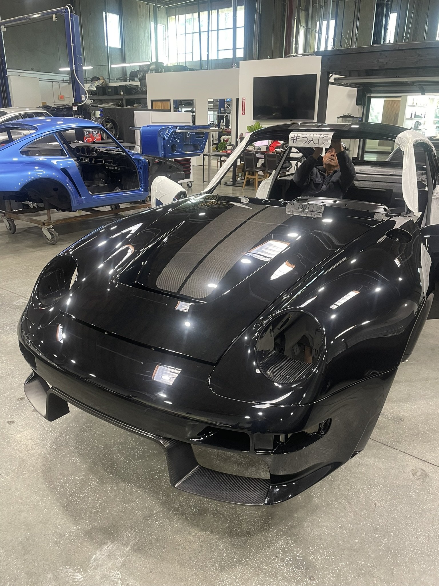 Turbo Florio 5 — Front view of Gunther Werks Turbo (Tornado) body showing exposed carbon fiber stripe on hood and roof. — #TurboFlorio5